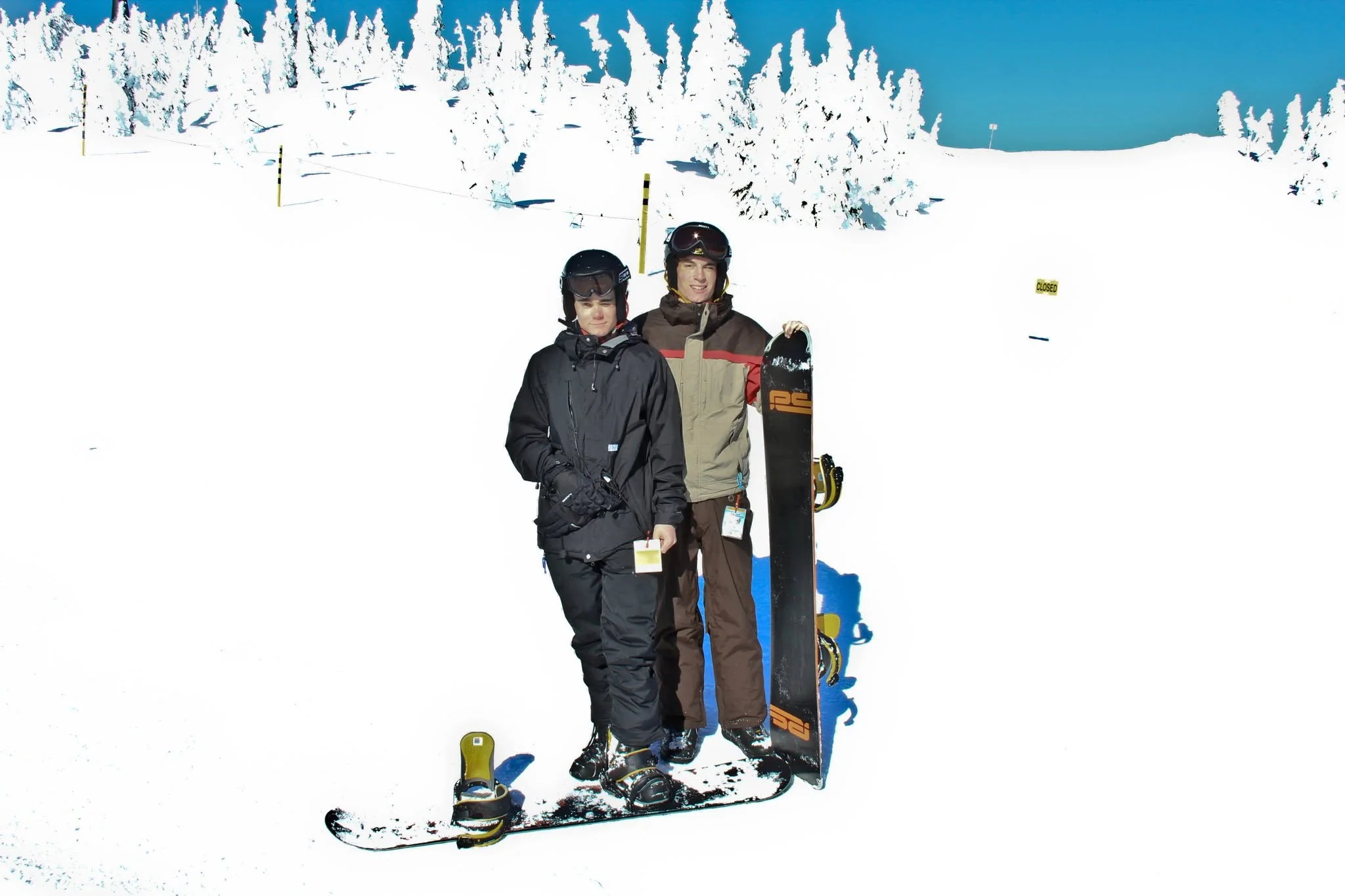 Owen posing with another snowboarder on a bright winter day at Mount Washington